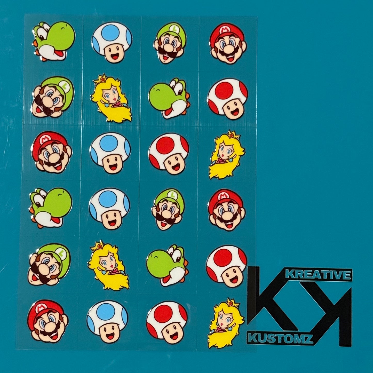An A5 sheet of 24 precut Super Mario character decals for glass cups on a blue background.
