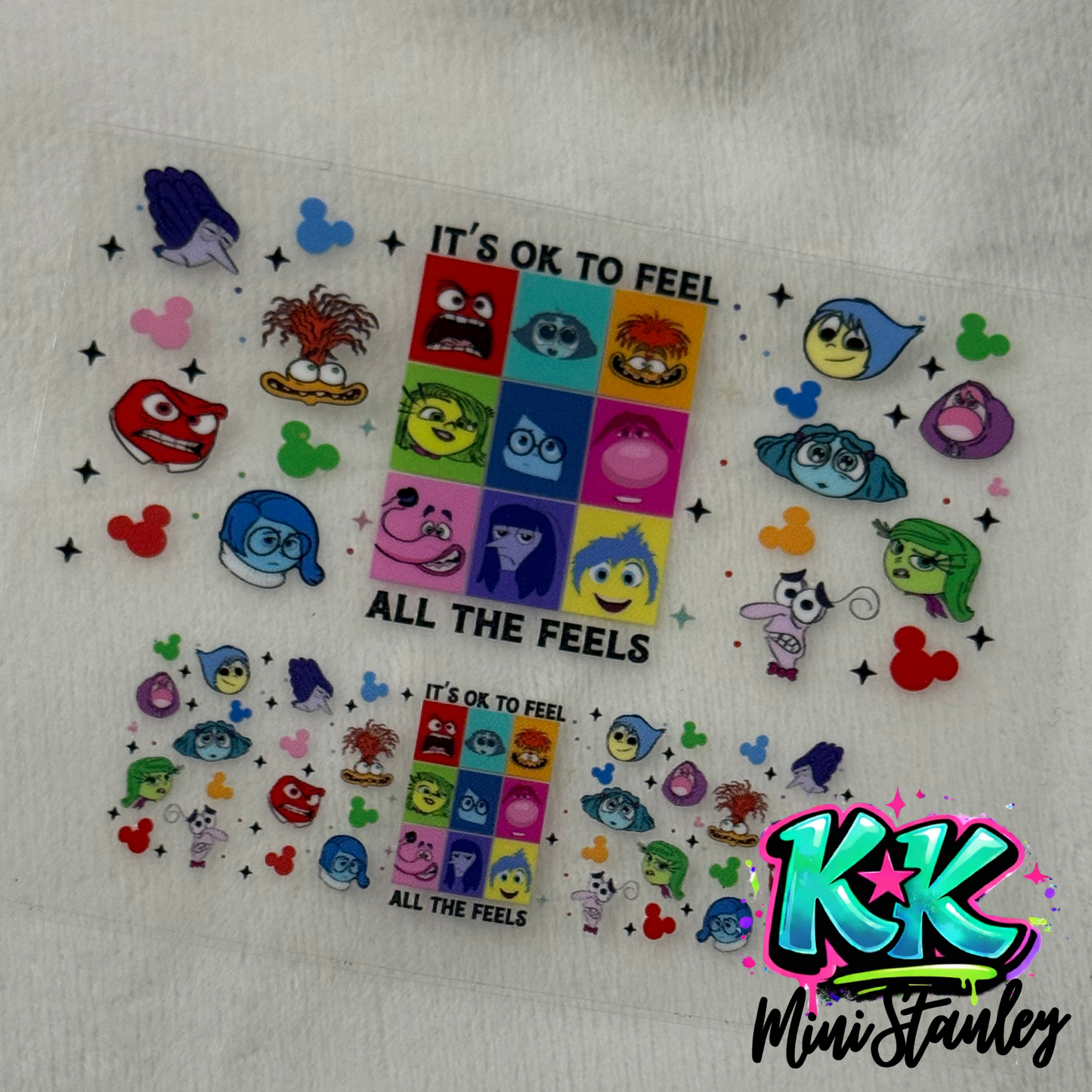 Two UV DTF adhesive wraps featuring Inside Out characters and Mickey icons on a clear sheet.