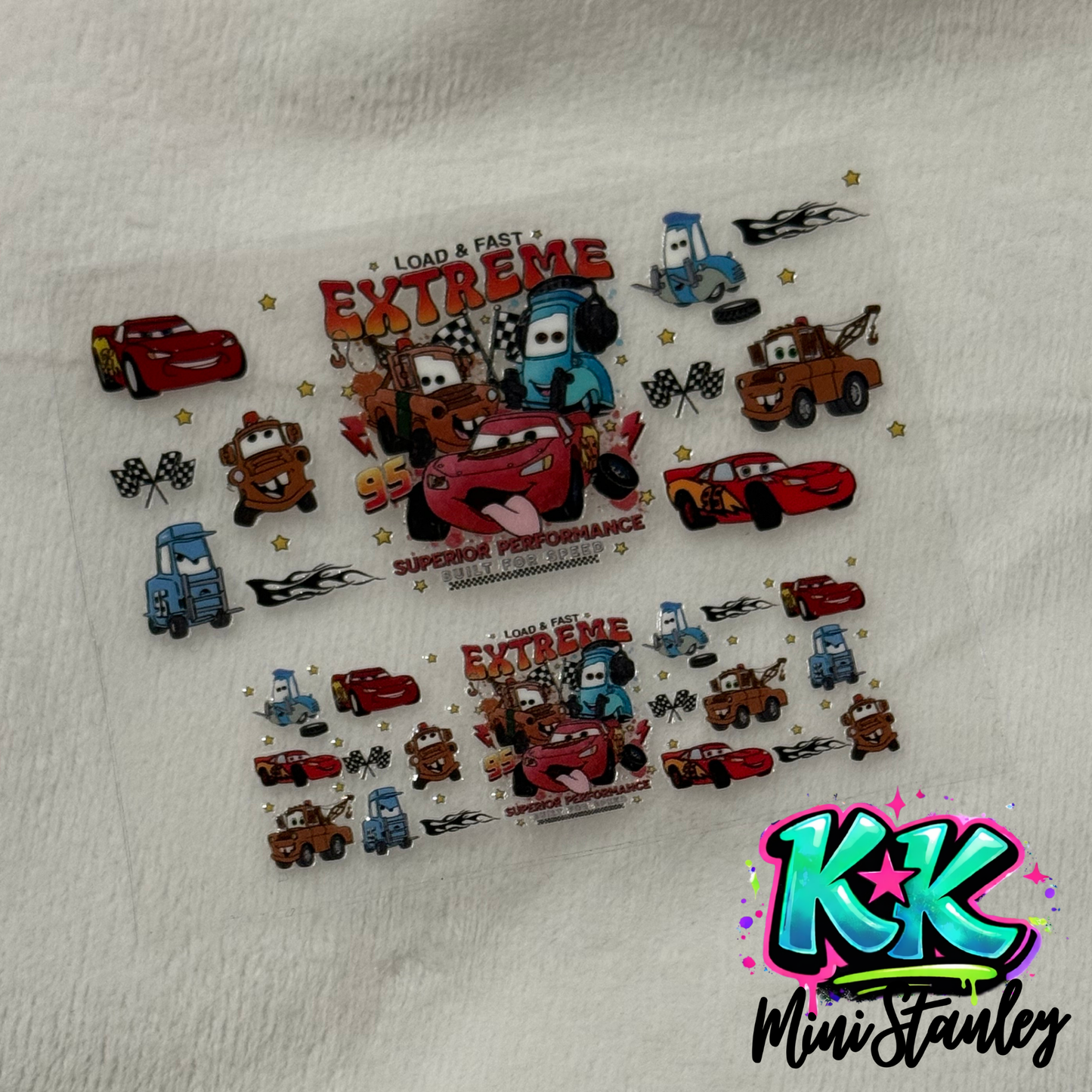 A UV DTF adhesive wrap featuring Cars characters for a mini keychain cup.