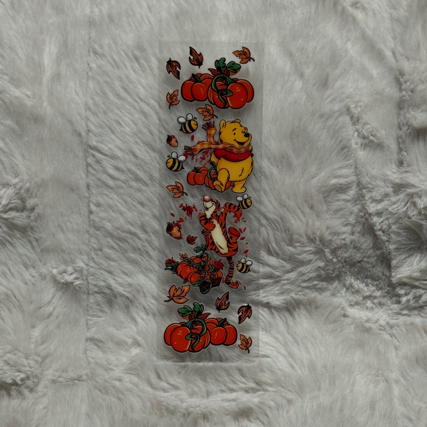 A rectangular UV DTF pen wrap featuring Winnie the Pooh, Tigger, pumpkins, and autumn leaves.