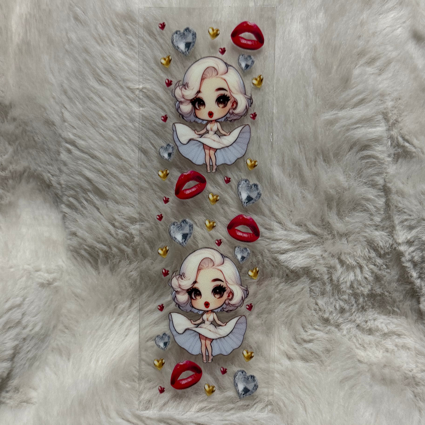 A rectangular UV DTF decal featuring two chibi Marilyn Monroe figures, red lips, and hearts.