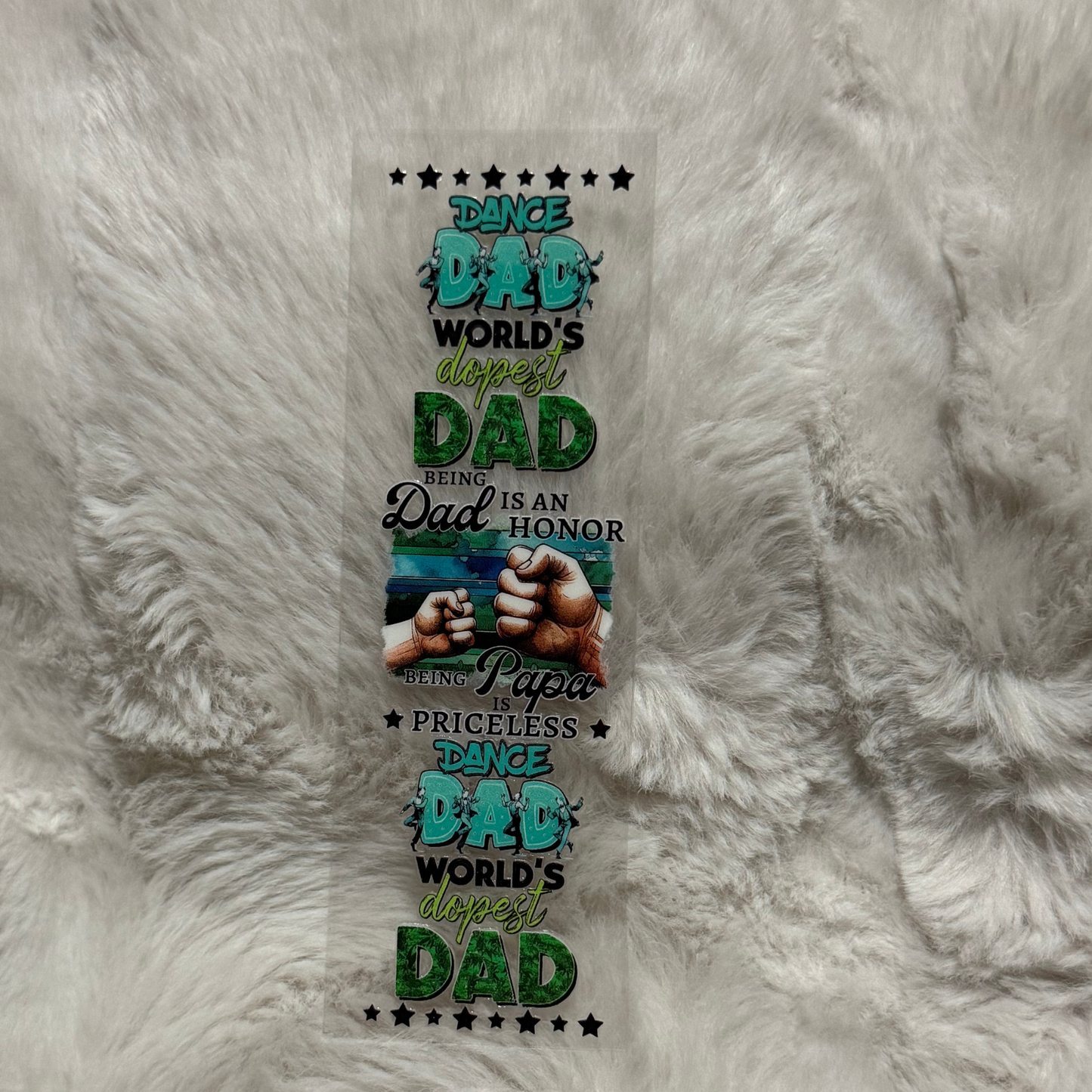 A rectangular UV DTF pen wrap featuring Dance Dad text, fist bumps, and stars on a clear backing.
