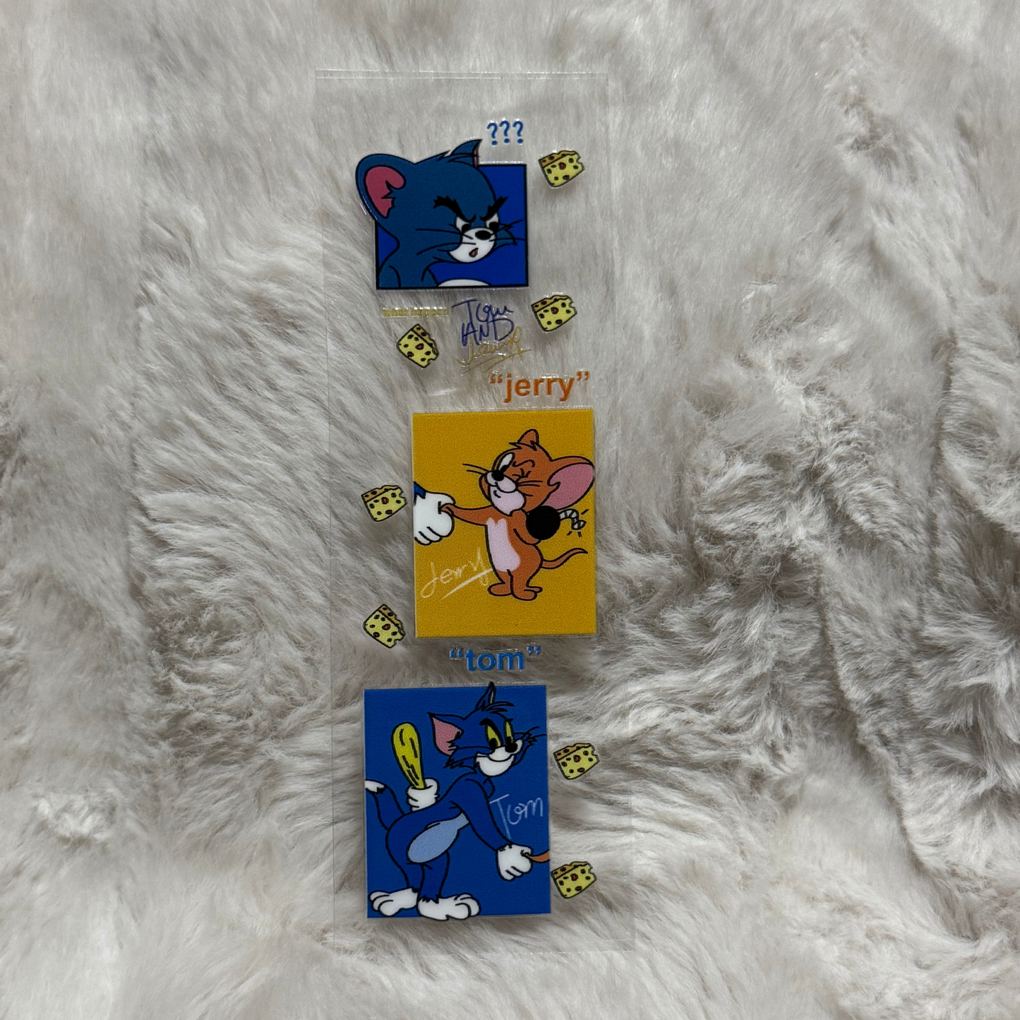 A rectangular UV DTF adhesive pen wrap featuring Tom and Jerry characters and cheese icons.