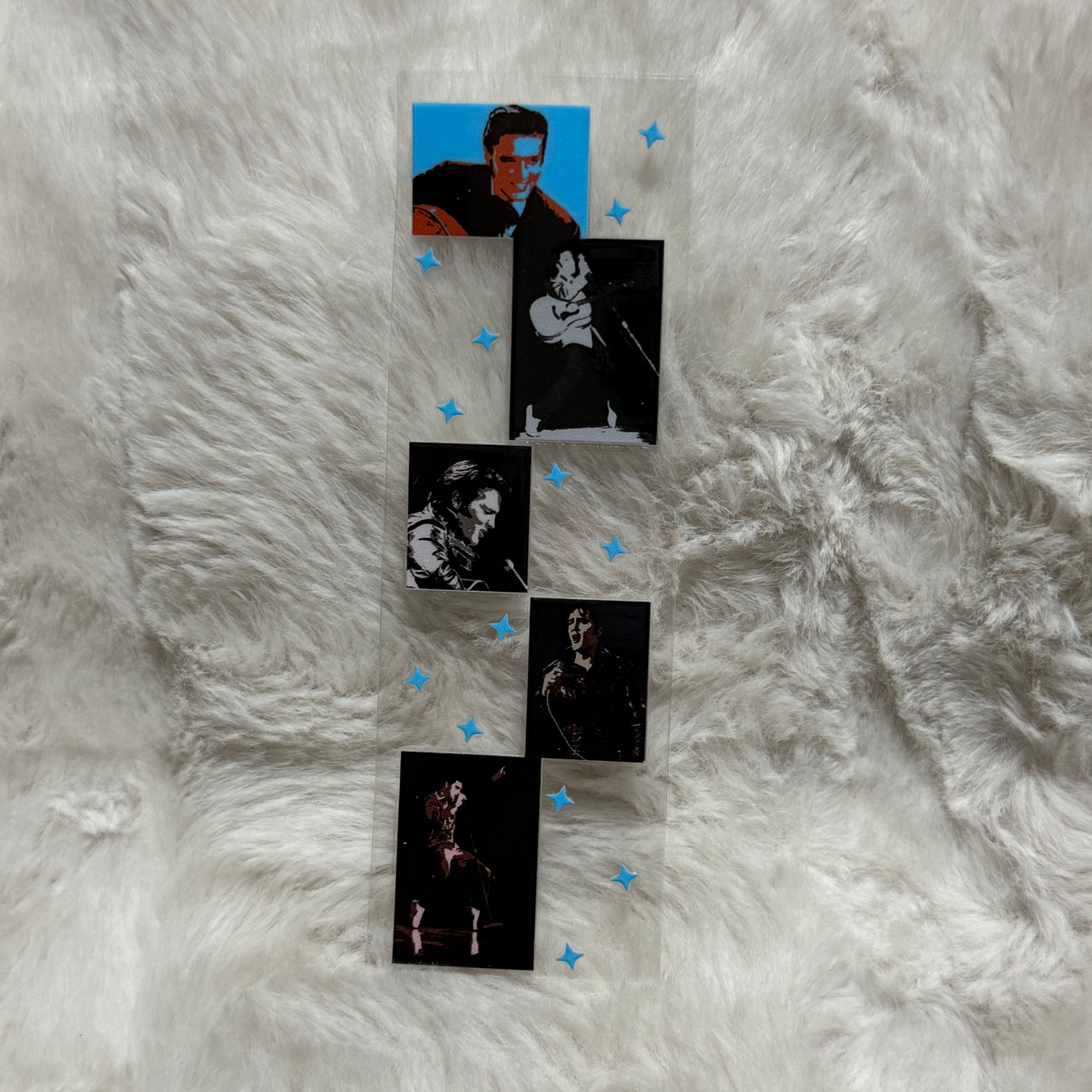 A rectangular UV DTF pen wrap featuring five Elvis Presley images and small blue star accents.