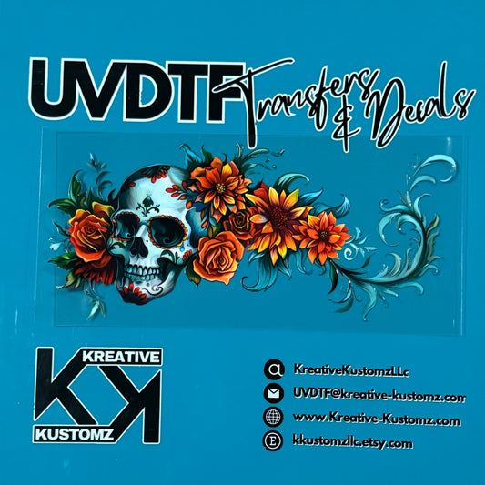A sugar skull and floral UV DTF adhesive wrap for a 16oz glass cup on a blue background.