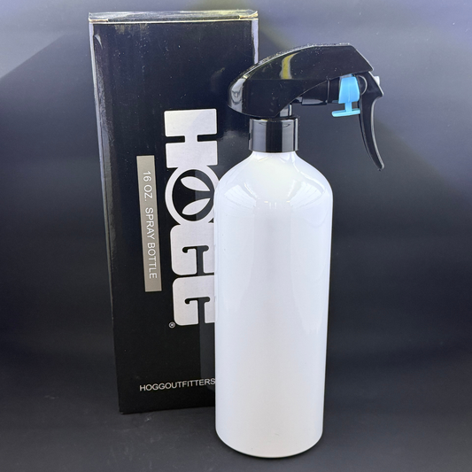 A white 16-ounce spray bottle stands in front of its black HOGG brand packaging box.