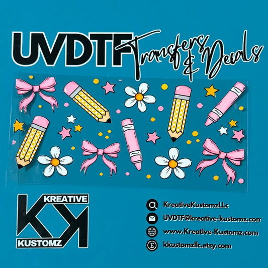 A UV DTF cup wrap featuring a pattern of pink bows, yellow pencils, crayons, and white flowers.