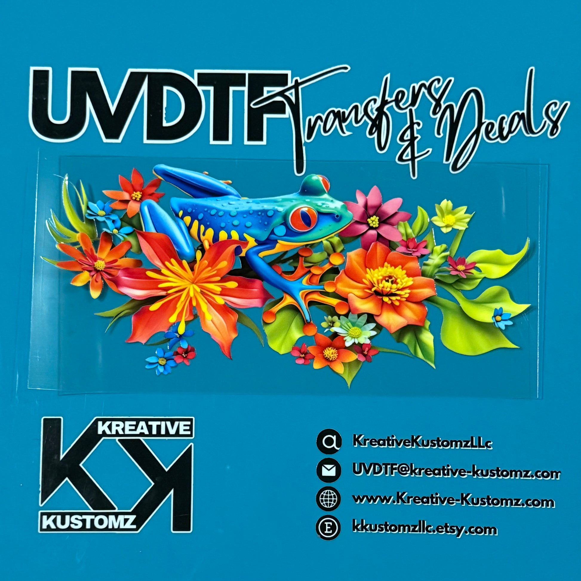 A UV DTF cup wrap featuring a blue frog surrounded by vibrant tropical flowers on a clear sheet.