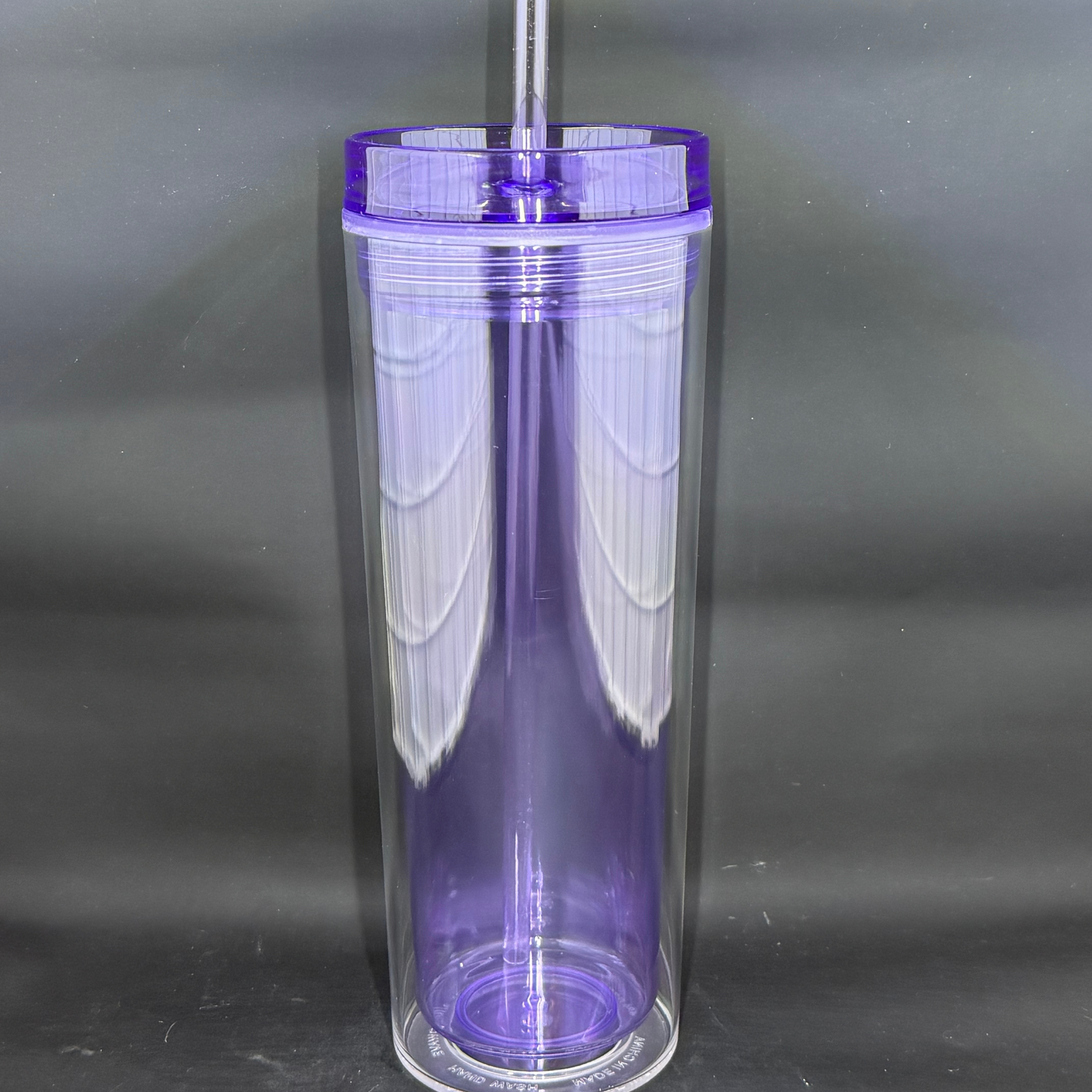 A 16oz light purple skinny acrylic tumbler with a clear lid and matching straw.
