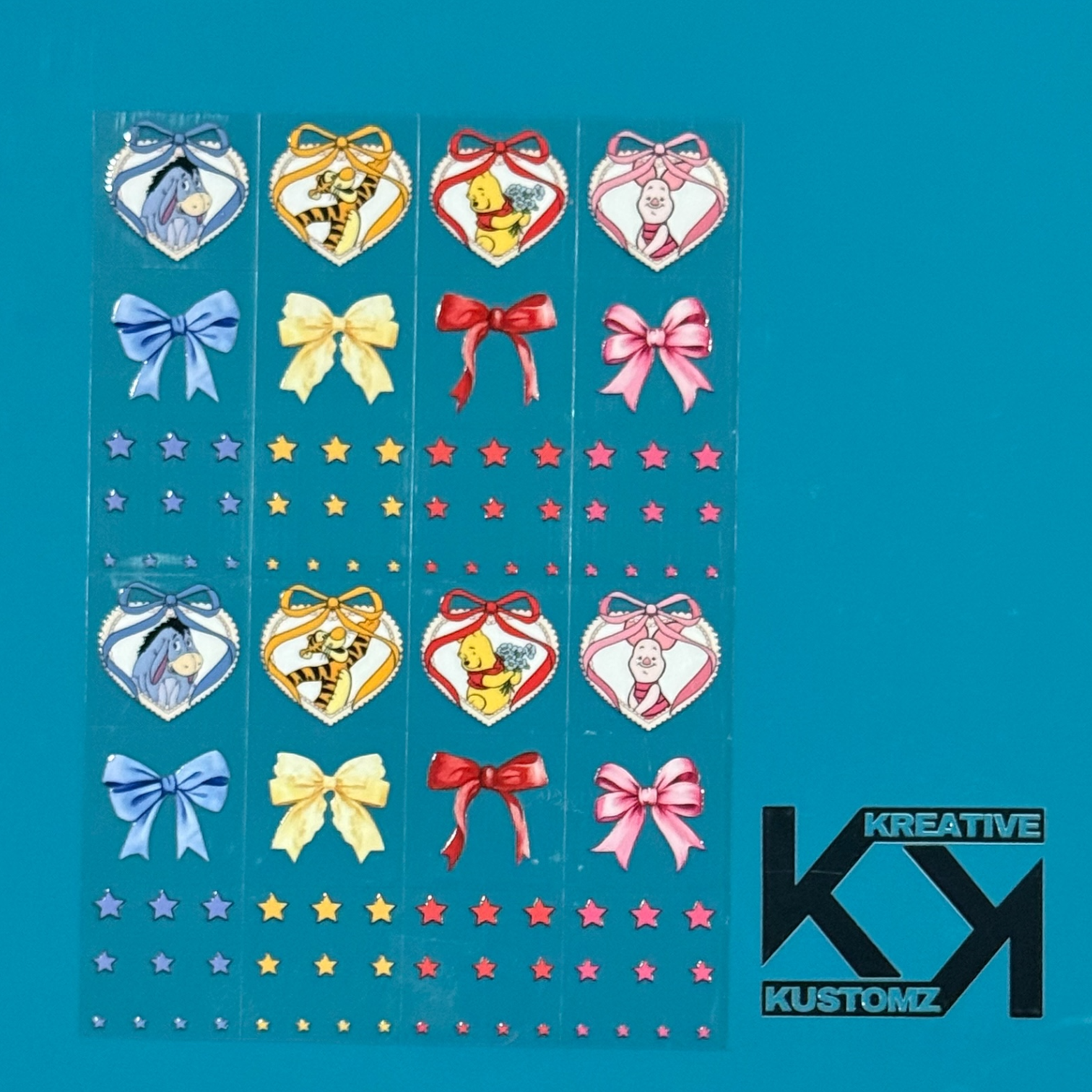 An A5 sheet of Winnie the Pooh themed UV DTF decals featuring hearts, bows, and stars.
