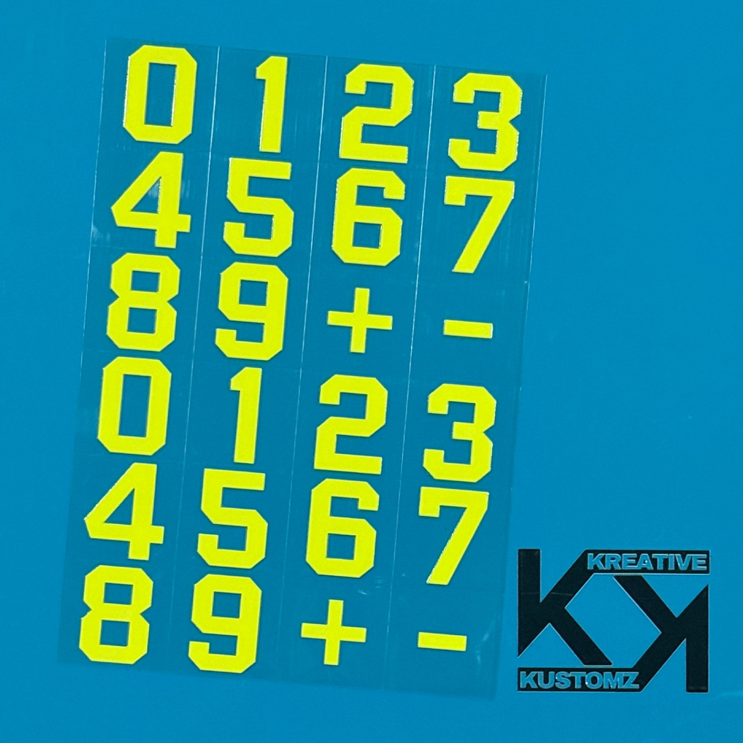An A5 sheet of lime green precut number and symbol decals on a blue background.