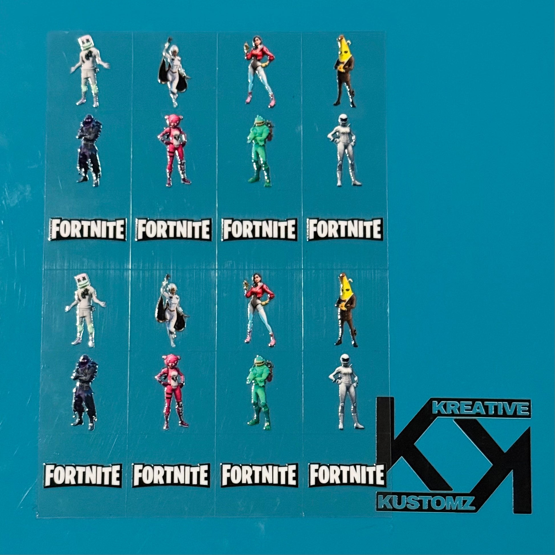An A5 sheet of precut Fortnite character decals featuring various skins and logos.
