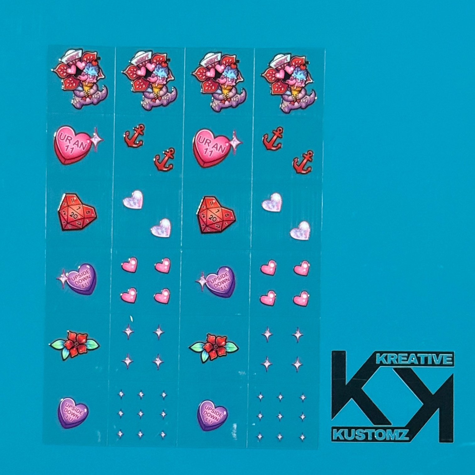 An A5 sheet of precut UV DTF decals featuring hearts, flowers, anchors, and character designs.