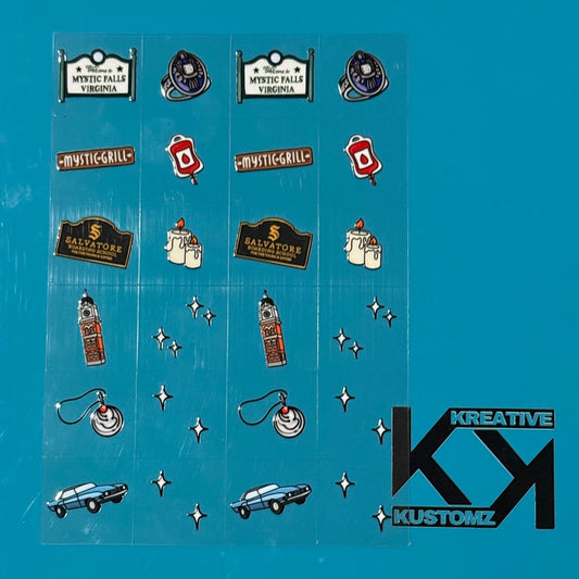 An A5 sheet of 24 precut Vampire Diaries themed adhesive decals on a clear backing.