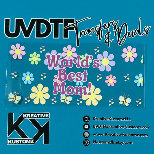 A UV DTF cup wrap featuring a World's Best Mom design with colorful flowers and butterflies.