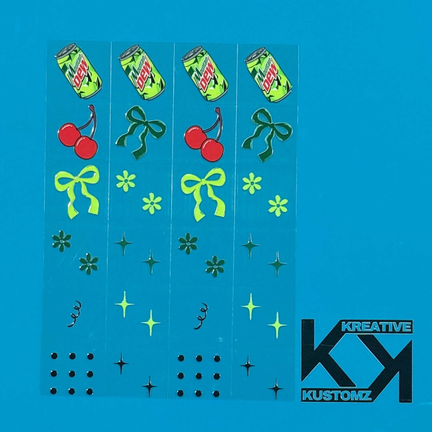 An A5 sheet of precut UV DTF decals featuring Mountain Dew cans, cherries, bows, and floral icons.