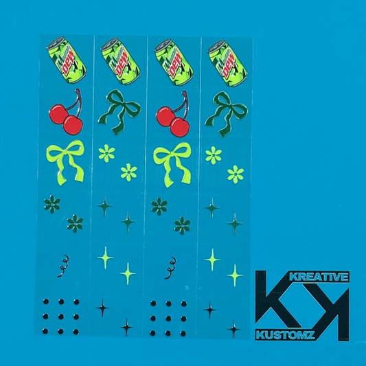 An A5 sheet of precut UV DTF decals featuring Mountain Dew cans, cherries, bows, and floral icons.
