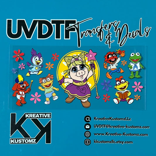 A UV DTF cup wrap featuring Muppet Babies characters and colorful flowers on a clear sheet.