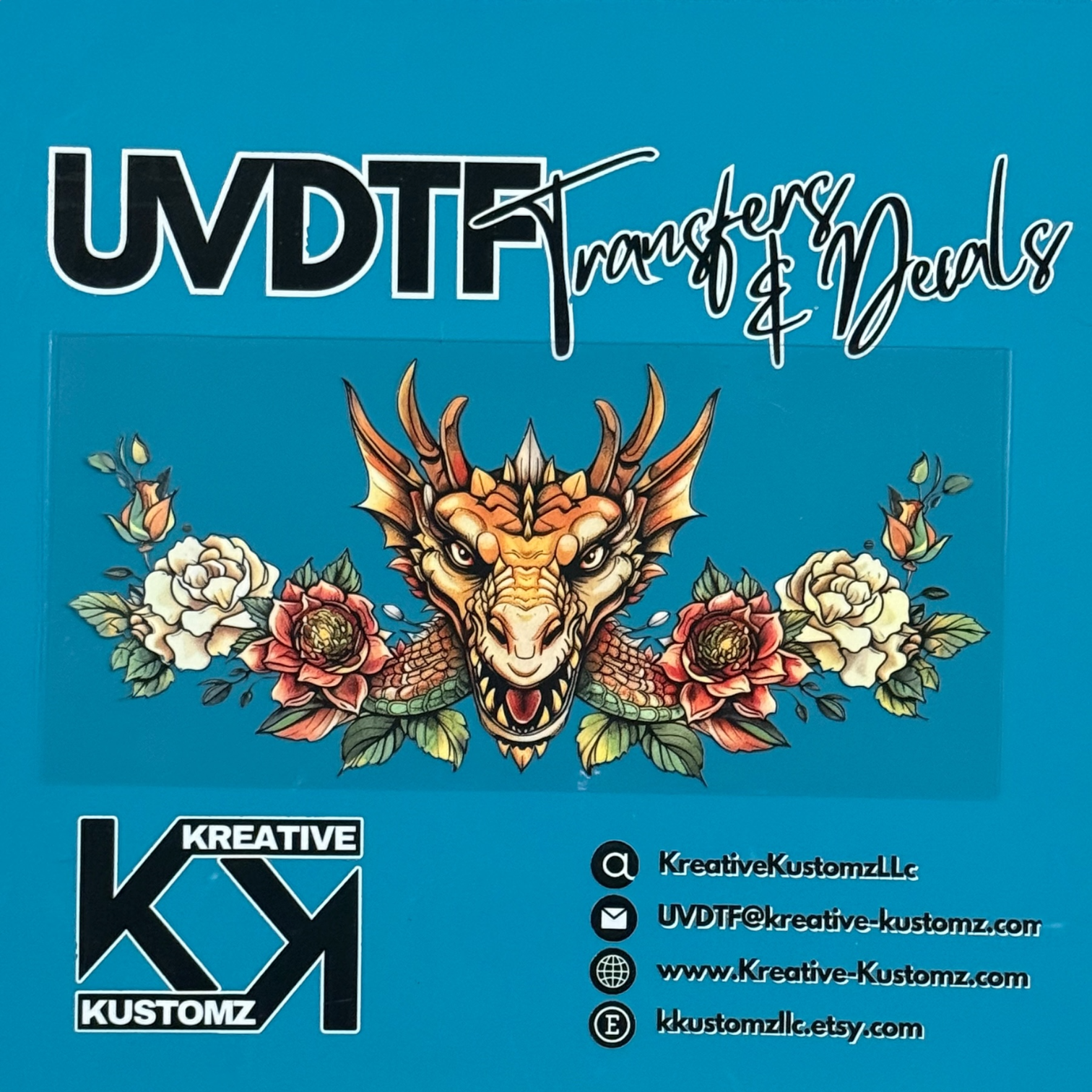 A UV DTF decal featuring a dragon head surrounded by flowers for a 16oz glass can.
