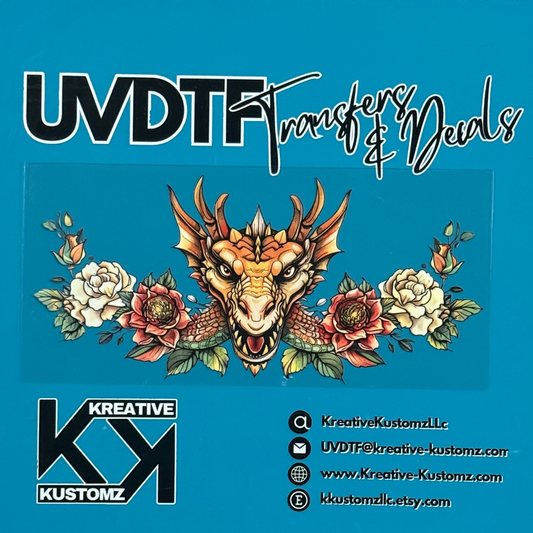 A UV DTF decal featuring a dragon head surrounded by flowers for a 16oz glass can.