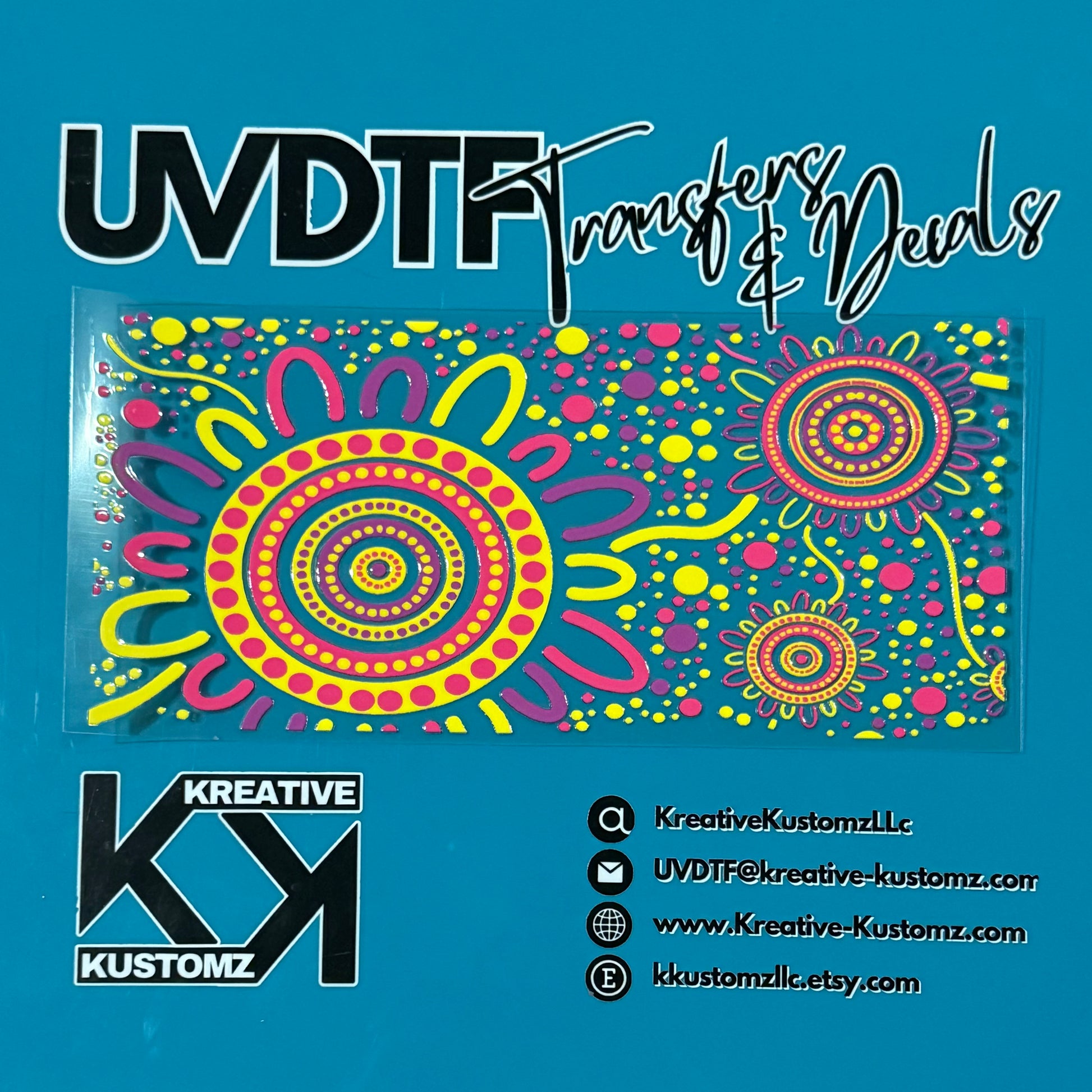 A colorful floral UV DTF adhesive wrap for a 16oz glass cup on a blue background.