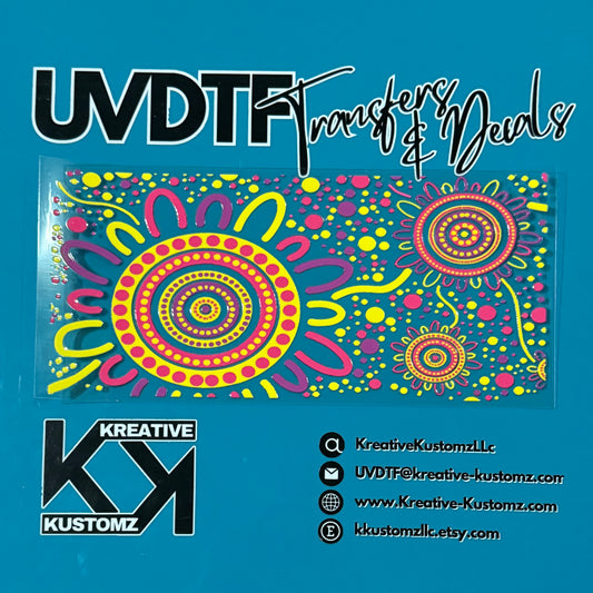 A colorful floral UV DTF adhesive wrap for a 16oz glass cup on a blue background.