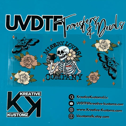 A UV DTF adhesive wrap featuring a skeleton, moths, and floral designs for a glass cup.