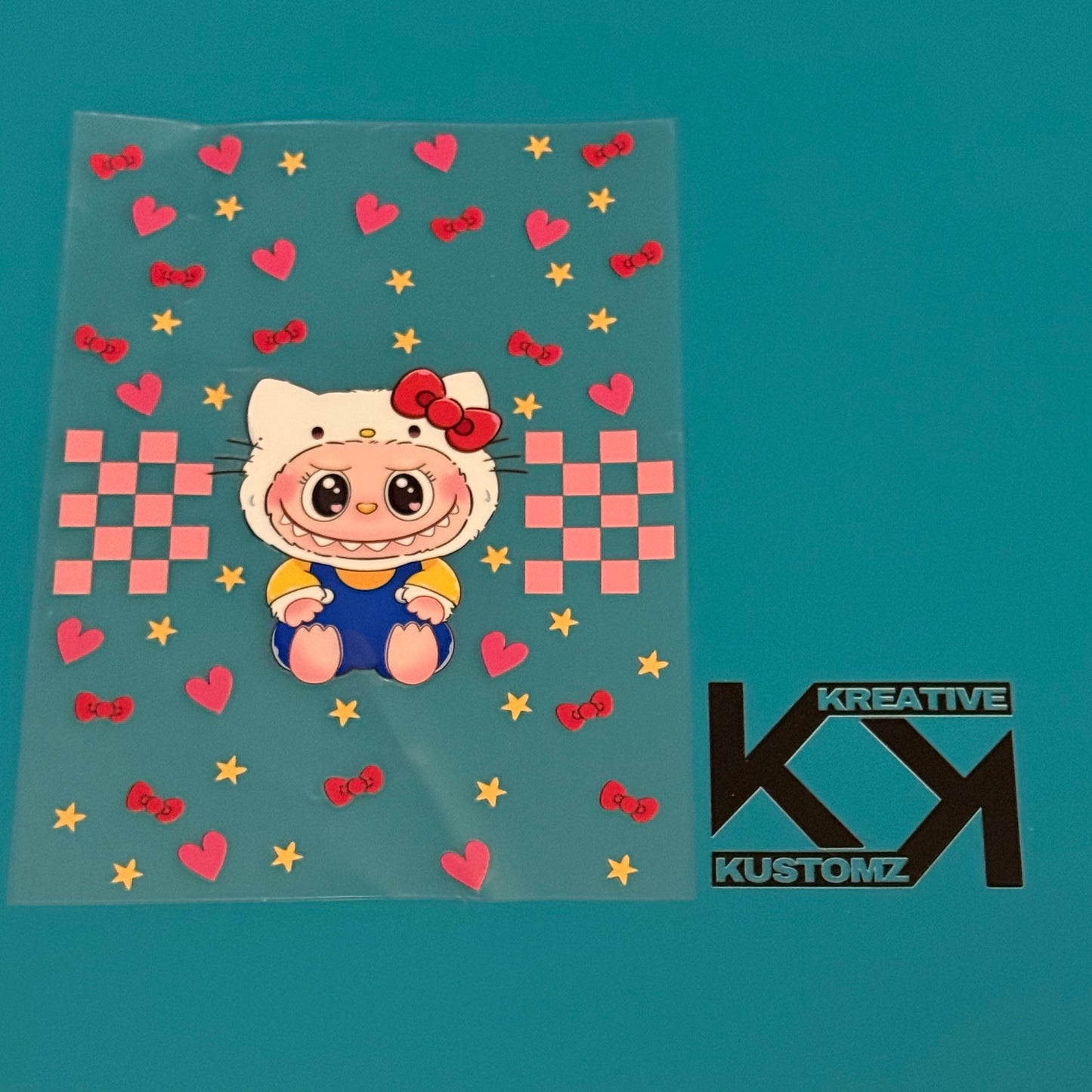 A Labubu character in a Hello Kitty costume is featured on this A5 UV-DTF notebook decal sheet.