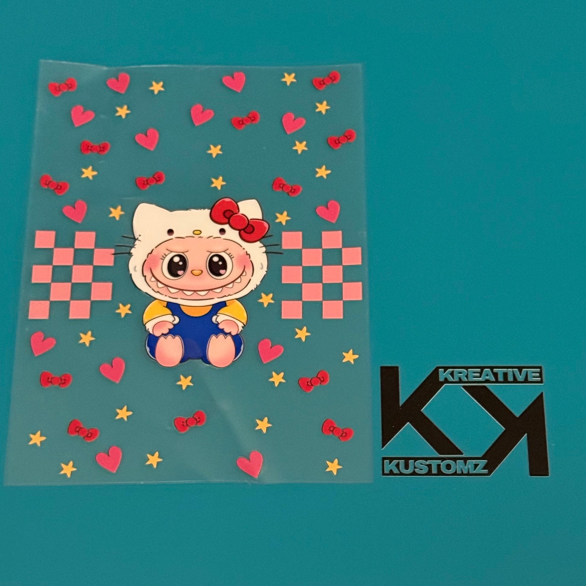A Labubu character in a Hello Kitty costume is featured on this A5 UV-DTF notebook decal sheet.