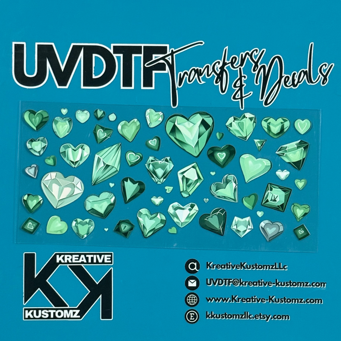 A sheet of green heart and gemstone shaped UV DTF adhesive decals for glass cups.
