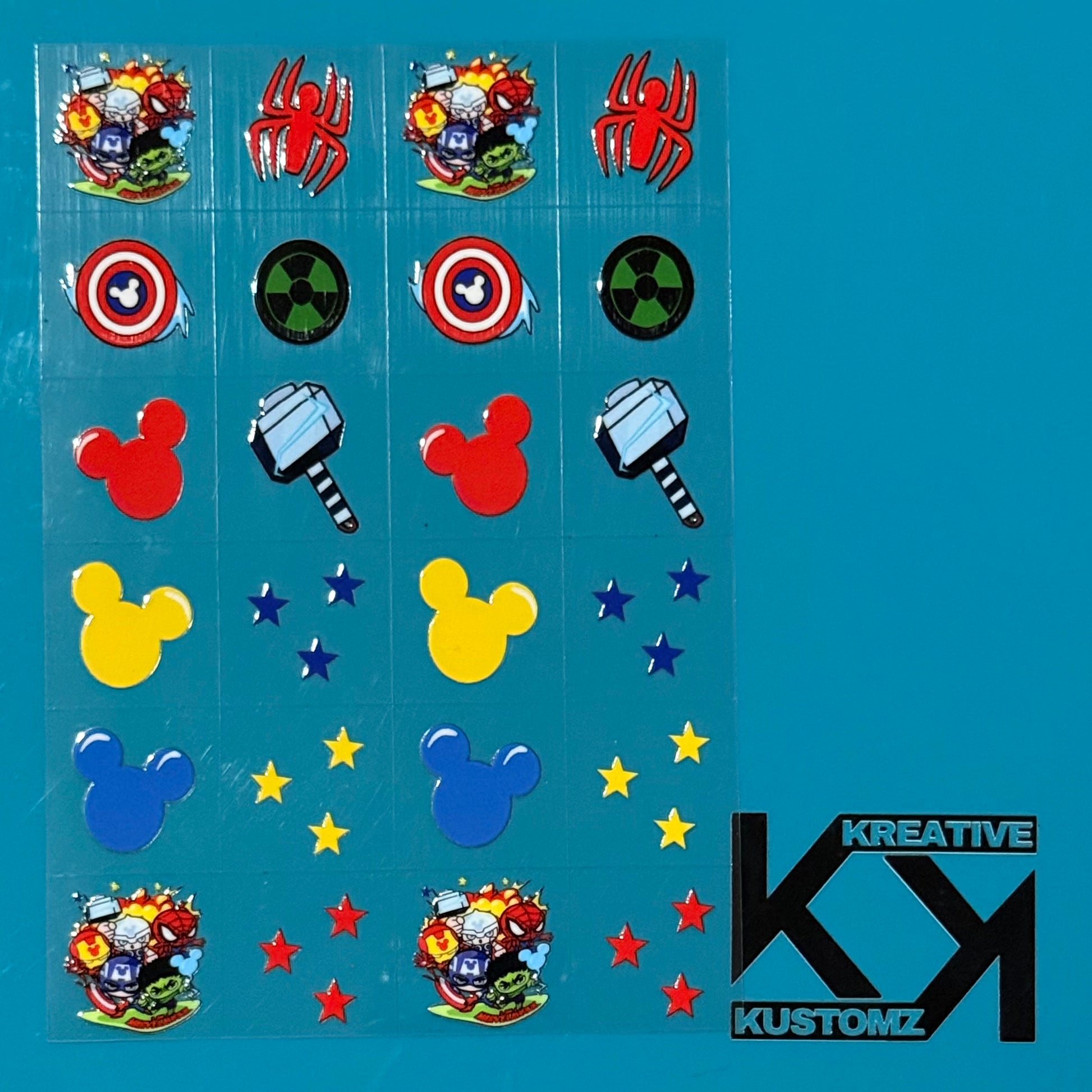 An A5 sheet of precut Marvel and Mickey-themed UV DTF decals on a blue background.