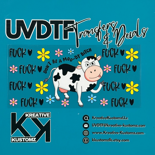 A UV DTF cup wrap featuring a cartoon cow, flowers, and the text Don't be a moo-dy bitch.