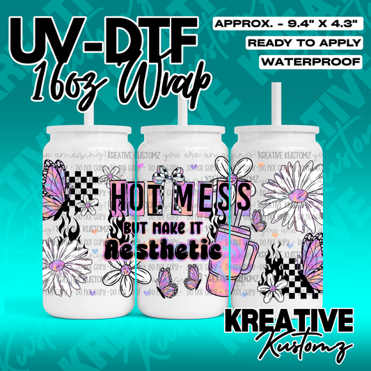 A UV DTF adhesive wrap for 16oz glass cans featuring butterflies, daisies, and the text hot mess.