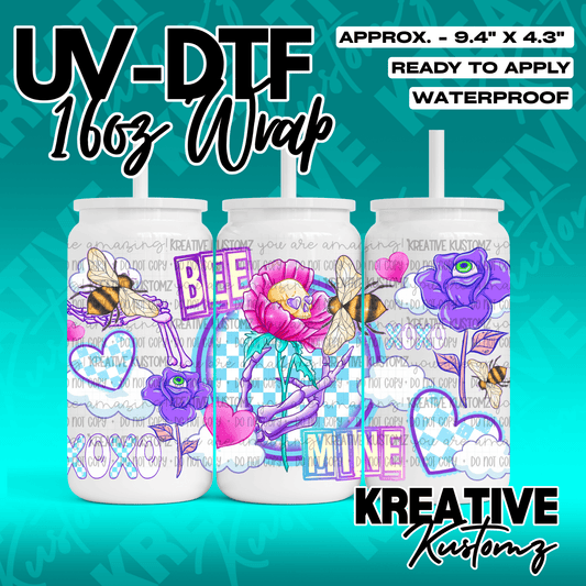 A UV DTF cup wrap featuring bees, skulls, flowers, and hearts on a checkered background.