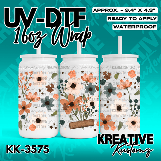 A floral UV DTF adhesive wrap for a 16oz glass can featuring orange and blue flowers.
