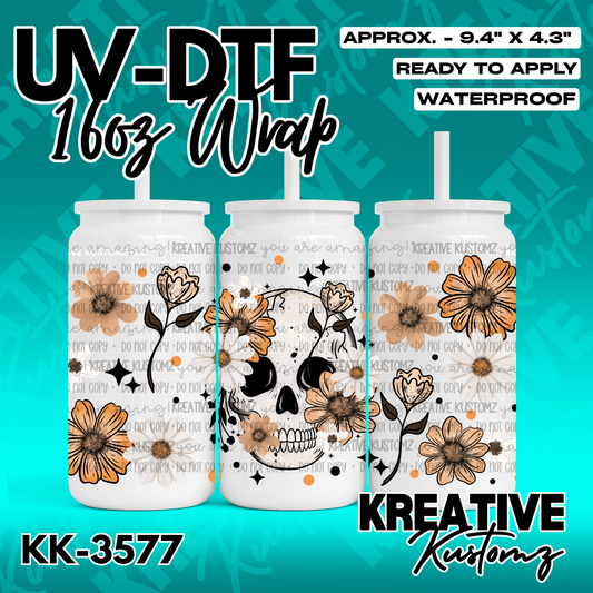 A floral skull design UV DTF adhesive wrap for a 16oz glass cup.