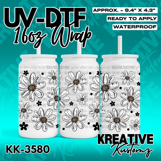 A floral UV DTF adhesive wrap for a 16oz glass cup featuring a black and white daisy pattern.