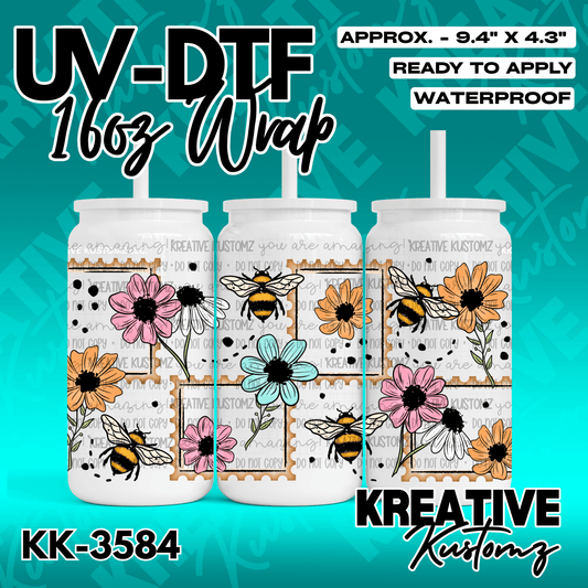 A UV DTF adhesive wrap for a 16oz glass cup featuring a pattern of bees and colorful flowers.