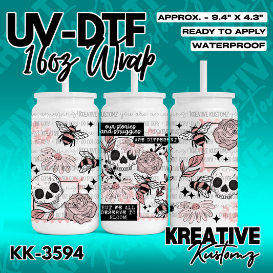 A UV DTF adhesive wrap for 16oz glass cans featuring a floral, skull, and bee design.