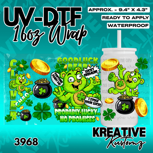 A UV DTF adhesive wrap featuring green cartoon bears, shamrocks, and gold coins for a glass cup.
