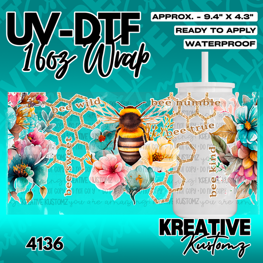A floral and bee themed UV DTF adhesive wrap for a 16oz glass cup.