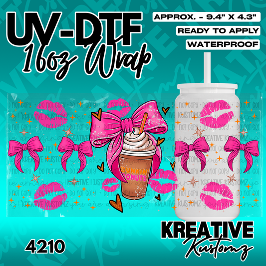 A UV DTF cup wrap featuring a coffee drink, pink bows, and lip prints for a 16oz glass can.