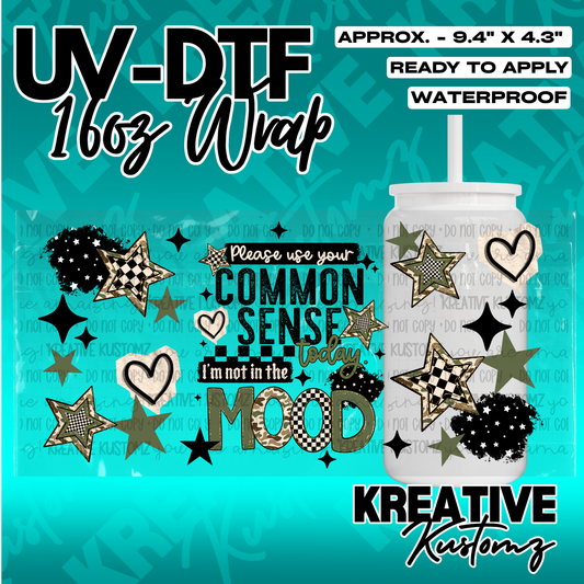 A UV DTF cup wrap featuring stars, hearts, and the text Please use your common sense today.
