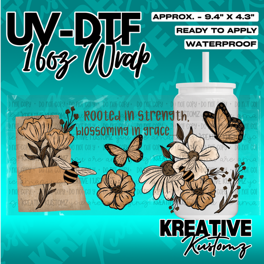 A floral and butterfly themed UV DTF adhesive wrap for a 16oz glass cup.