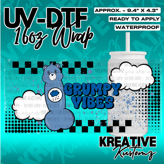 A Grumpy Bear themed UV DTF adhesive wrap for a 16oz glass cup with a blue and black design.