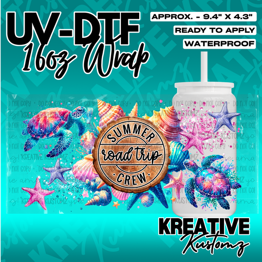 A colorful sea turtle and seashell themed UV DTF adhesive wrap for a 16oz glass cup.