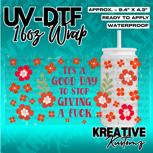 A UV DTF cup wrap featuring red flowers and the text It's a good day to stop giving a fuck.