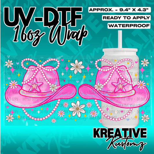 A UV DTF adhesive wrap for 16oz glass cans featuring pink cowboy hats, pearls, and daisies.