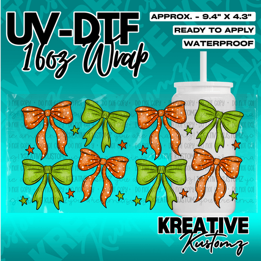A UV DTF cup wrap featuring a pattern of orange and green bows with small stars.