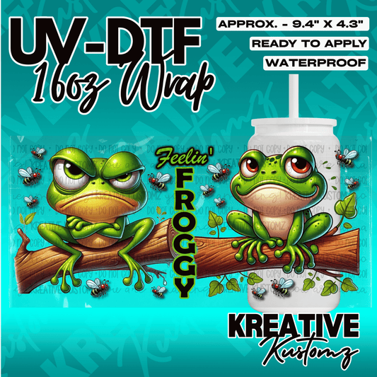 A UV DTF adhesive wrap for 16oz glass cups featuring two cartoon frogs on a branch with flies.